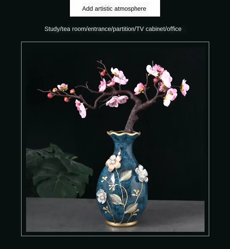 Deep blue ceramic vase with gold-trimmed floral design and flared rim holding pink blossoms for dried flowers