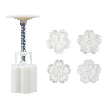 White plastic flower-shaped cherry blossom mooncake press with four matching floral molds by decorbites 3d cherry