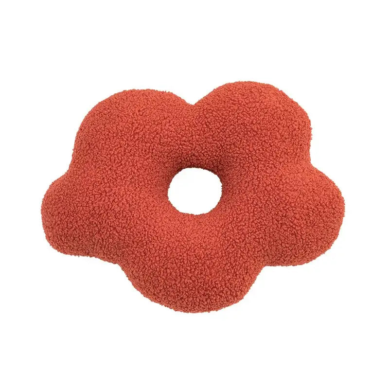 A plush coral-colored cloud-shaped pillow with soft textured surface from decorbites 3d flower nordic cushion set