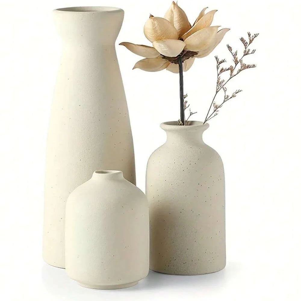 Three cream-colored speckled ceramic vases in a modern bohemian farmhouse set for living room and dining table decor