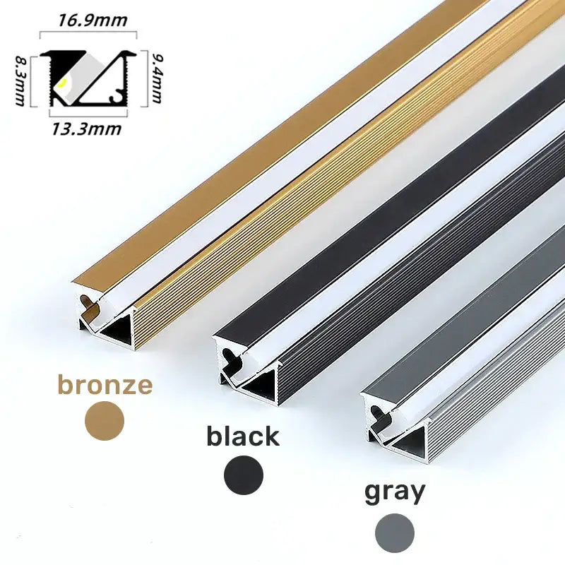 Three metallic threshold strips in bronze black and gray finishes with ribbed design for led aluminum profile corner trim