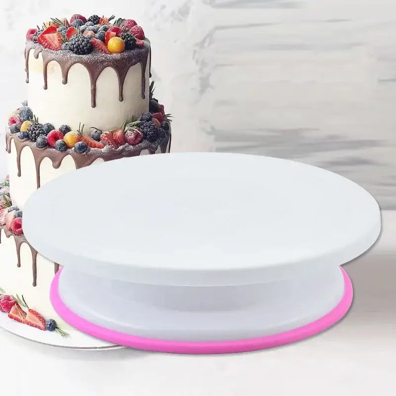 White plastic cake stand with vibrant pink silicone rim from 6-piece blue multicolored decorbites cake decorating turntable set