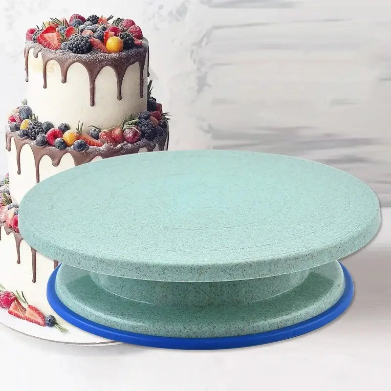 Teal speckled cake decorating turntable with blue base included in 6-piece decorbites cake decorating set