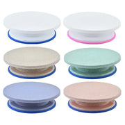 Six colorful round plastic cake decorating turntables with blue bases from the decorbites cake decorating set