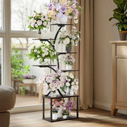 DecorBites™ black metal 7 tier plant stand display rack with white pink and purple flowers in various vases