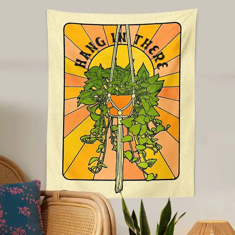 Cream-colored decorbites botanical tapestry wall hanging with a vibrant hanging plant and hang in there text
