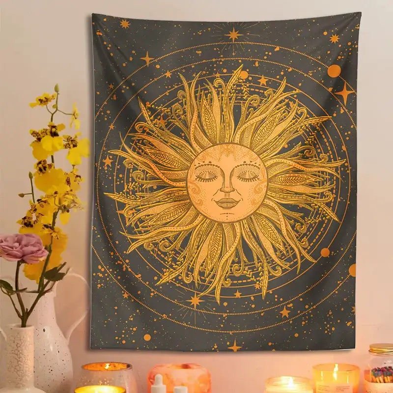 A golden decorbites celestial sun with feather-like rays and serene face on a celestial sun moon wall tapestry