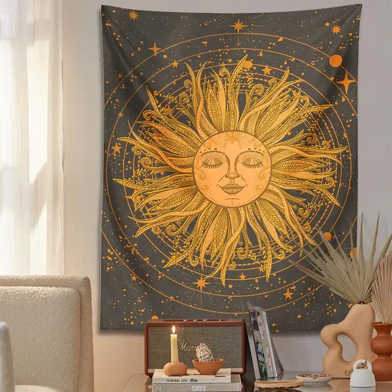 A golden decorbites celestial sun with feathered rays and serene face on an ornate sun moon wall tapestry for bedroom decor