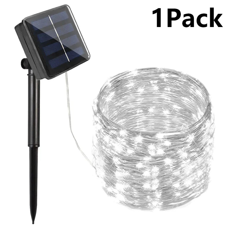 Black solar-powered garden string lights with clear warm white led bulbs for outdoor patio wedding and garden use