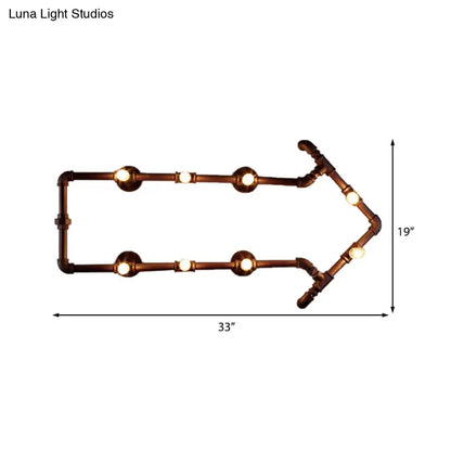 Aplique de pared industrial de bronce con diseño de flecha y detalle de tubería de agua, con 8 luces.
