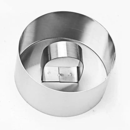 Shiny stainless steel bakeware mold with round cake ring and hinged lid in 9 piece stainless steel bakeware set