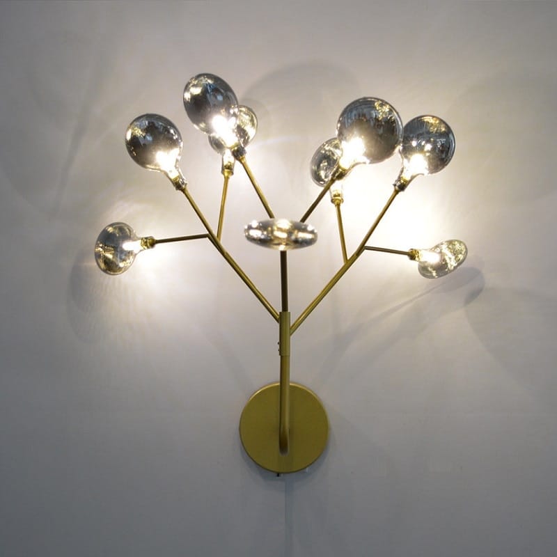 Modern gold firefly tree branch led wall light featuring a gold-toned wall sconce with multiple branching arms each ending in a reflective spherical glass bulb.