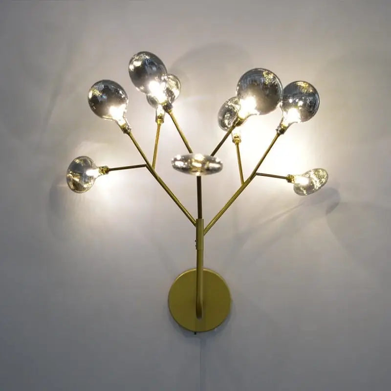 modern gold firefly tree branch led wall light featuring a gold-toned metal frame with multiple spherical glass bulbs arranged in a branching tree-like design for bedroom use.