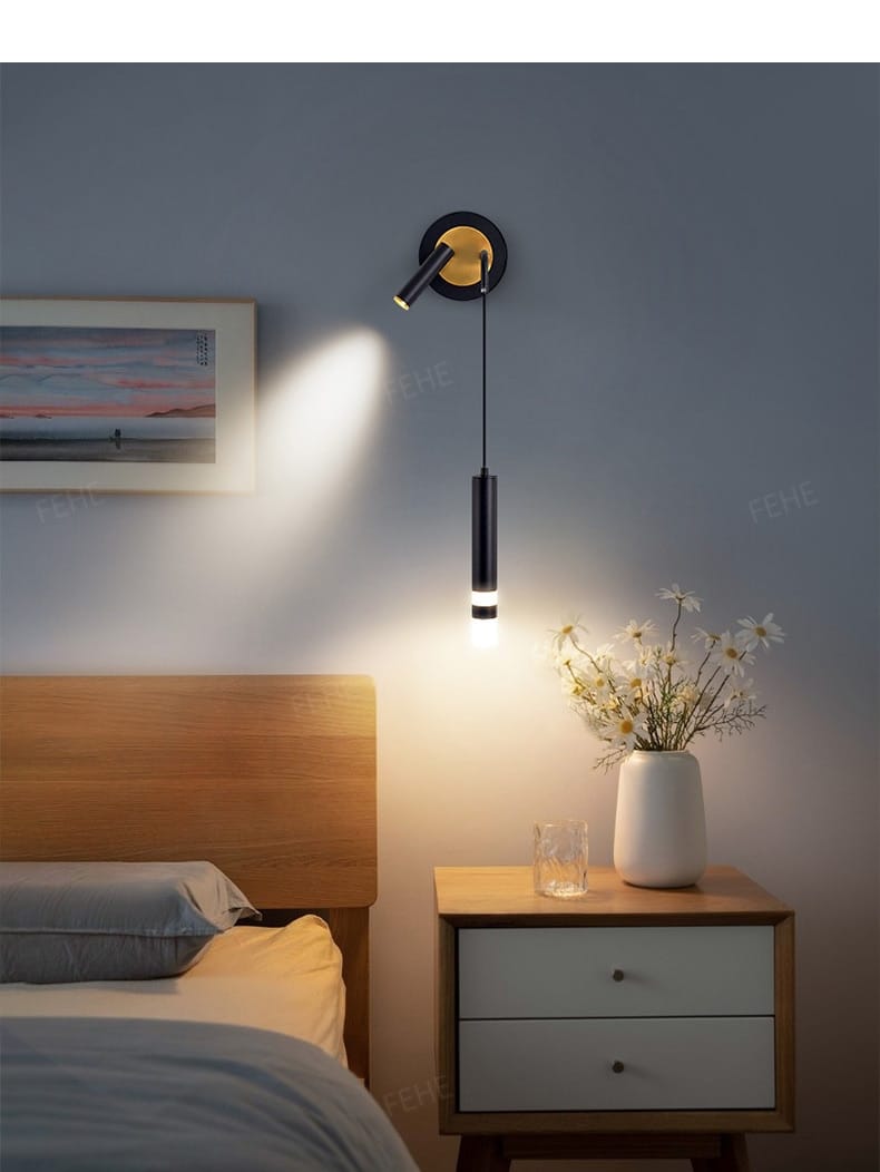 Minimalist creative luxury black and gold wall-mounted bedside lamp with a sleek cylindrical design for a luxury bedroom bedside lighting.