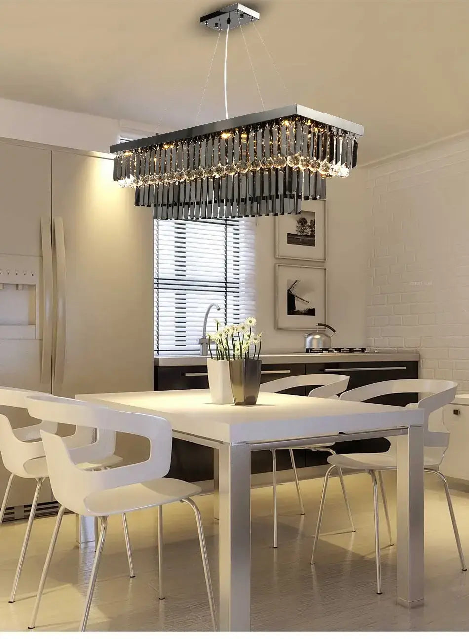 A modern black rectangle crystal chandelier featuring a sleek chrome frame and cascading rows of clear faceted crystal prisms ideal for dining room hanging light.