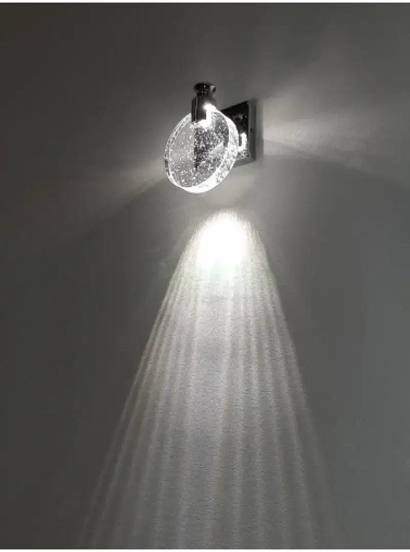 Modern gold crystal led wall lamp featuring three clear spherical globes filled with sparkling crystals and a sleek black metal base, designed as a simple crystal led wall fixture for bathroom use.