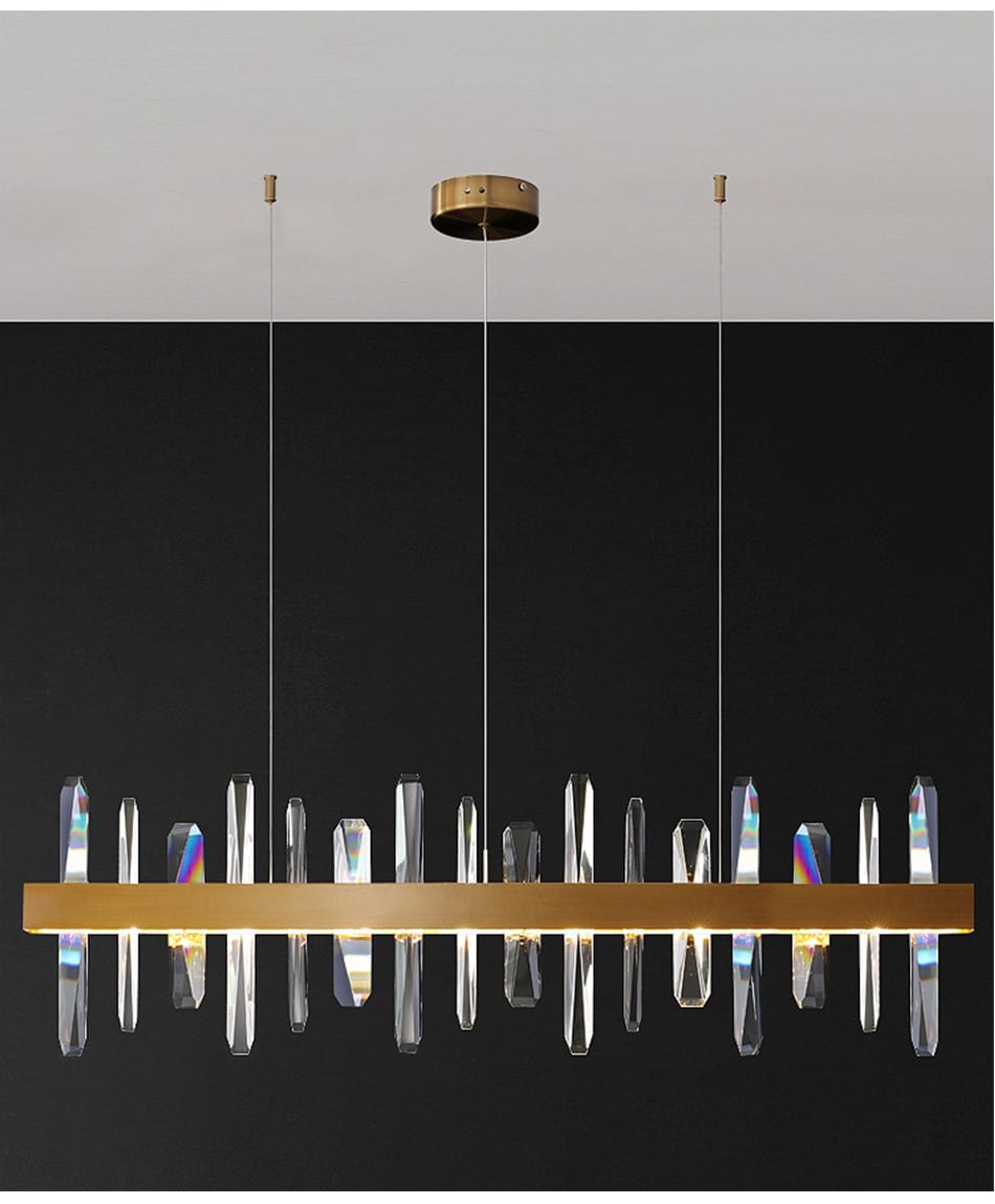 modern rectangle gold crystal chandelier featuring clear crystal prisms suspended from a central bar for dining room lighting.