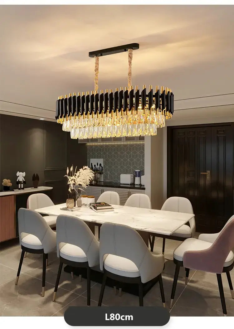 Black and gold nebra luxury k9 crystal tiered chandelier with crystal droplets hanging above a dining table is a luxury k9 crystal dining room light and crystal chandelier.