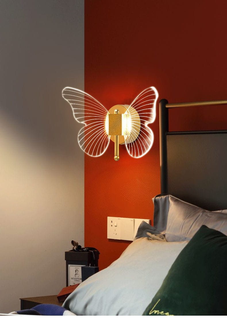 modern nordic gold led butterfly wall lamp featuring a gold-toned copper led butterfly design with illuminated translucent wings for bedroom use.
