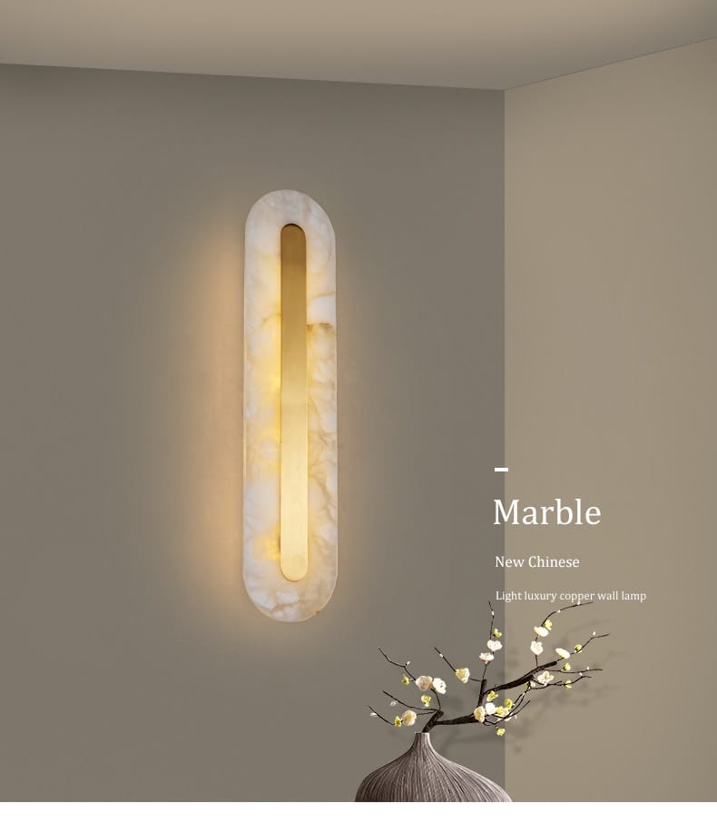 A sleek elongated postmodern wall lamp with polished white copper marble finish and integrated warm yellow light for living room decor.