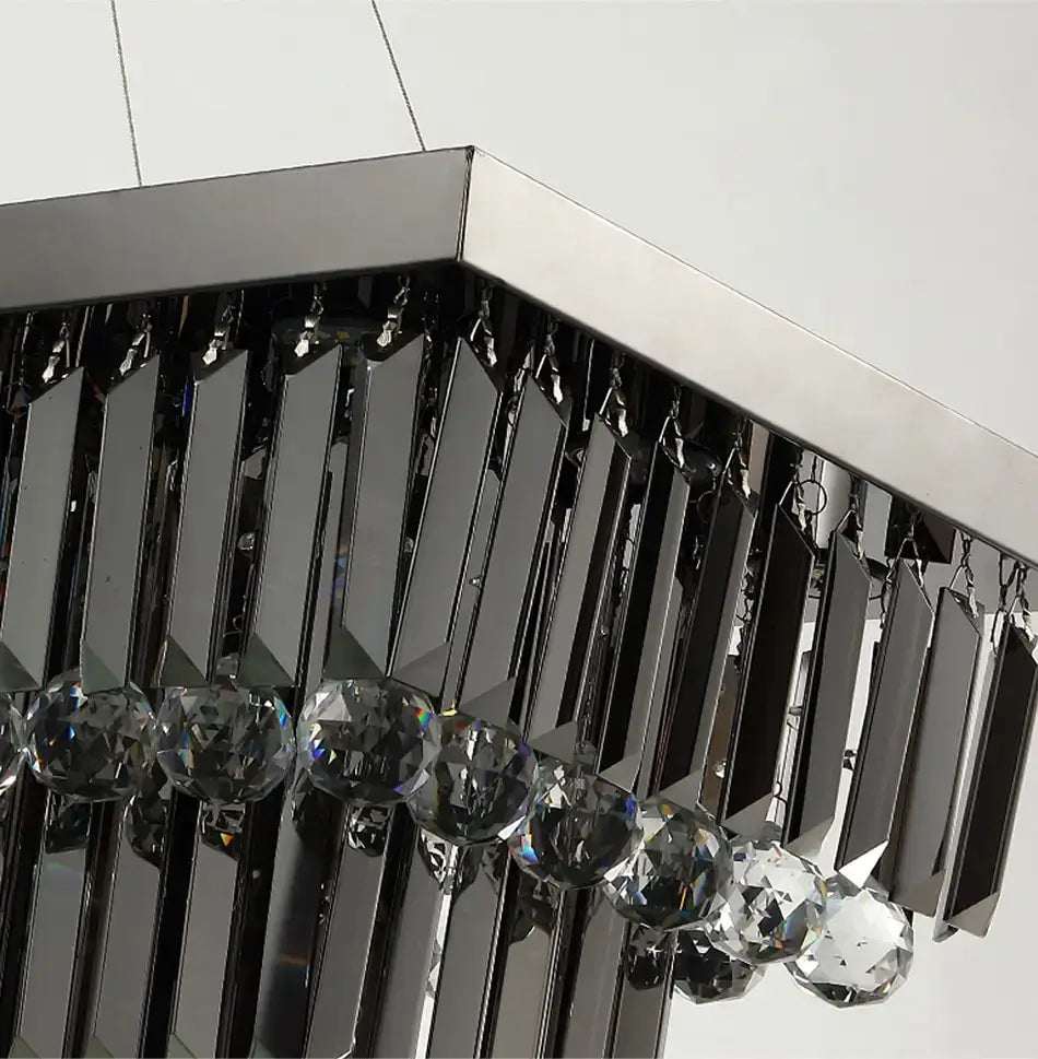 Modern black rectangle crystal chandelier featuring sleek chrome accents and faceted glass spheres designed for dining room hanging light.