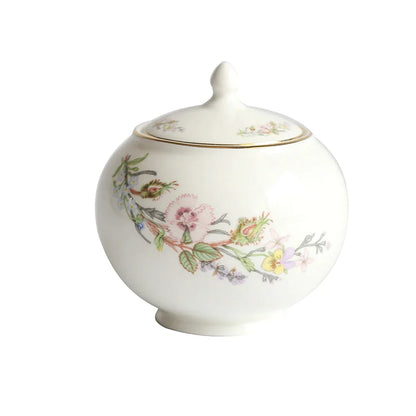 Juego de té DecorBites™ de porcelana fina: tetera, taza, platillo, plato de fruta, bandeja, tazas y vajilla.