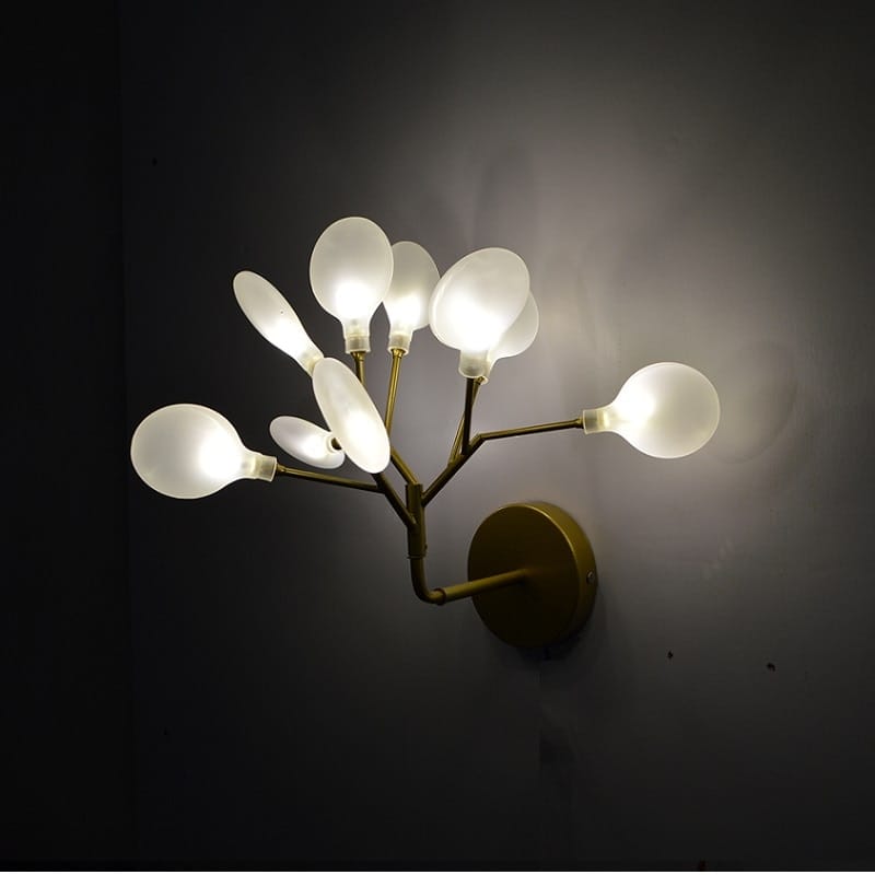 Modern gold firefly tree branch led wall light featuring a gold-toned metal frame with multiple frosted glass bulb fixtures arranged in a branching design suitable for bedroom use.