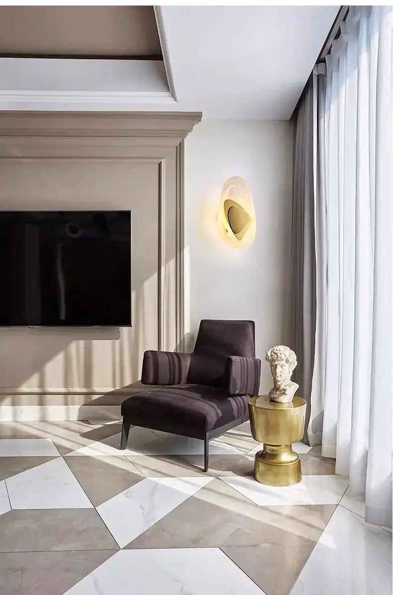 A sleek dark purple velvet armchair with striped upholstery complements a modern creative minimalist glass wall lamp designed for bedroom bedside lighting.