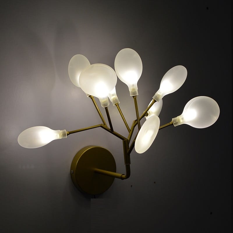 Modern gold firefly tree branch led wall light featuring a gold-toned metal frame with multiple frosted glass bulb shades arranged in a branching design ideal for bedroom use.