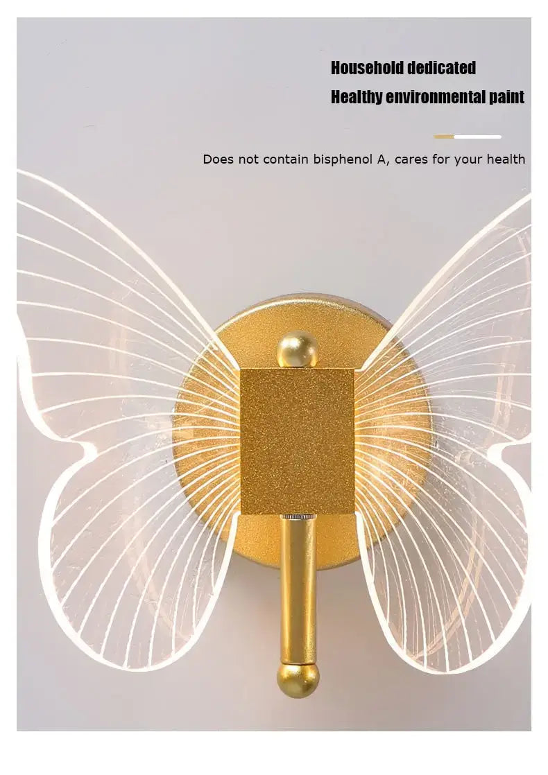 Modern nordic gold led butterfly wall lamp featuring a gold-colored butterfly-shaped copper led butterfly hook with translucent wing details and a square central plate for bedroom use.