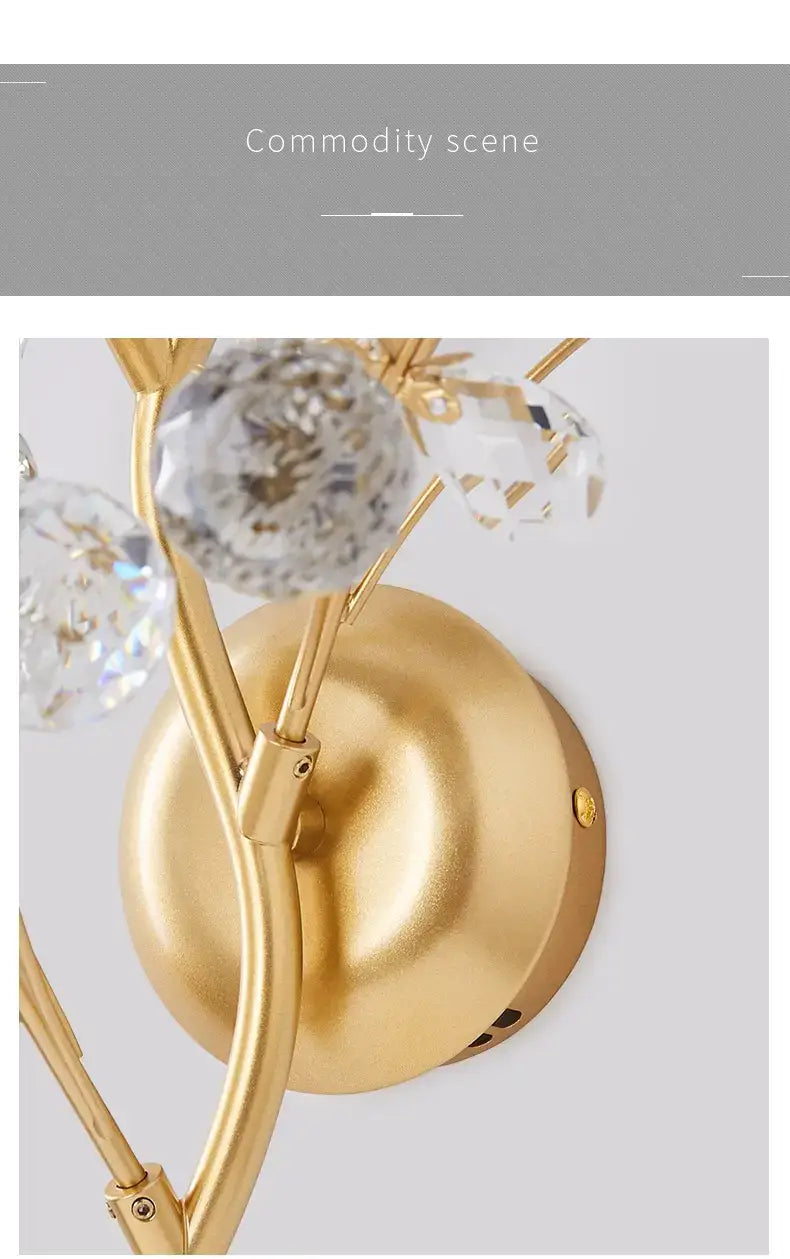 post modern luxury gold-toned wall sconce with crystal accents in a luxury branch style for bedroom lighting