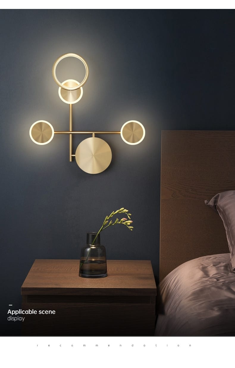 Modern golden geometric led wall lamp featuring gold-toned circular and disc-shaped illuminated elements arranged in a geometric pattern for living room use.