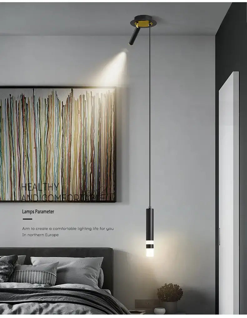 Minimalist creative luxury black and gold pendant light with a sleek cylindrical design for a luxury bedroom bedside wall lamp.