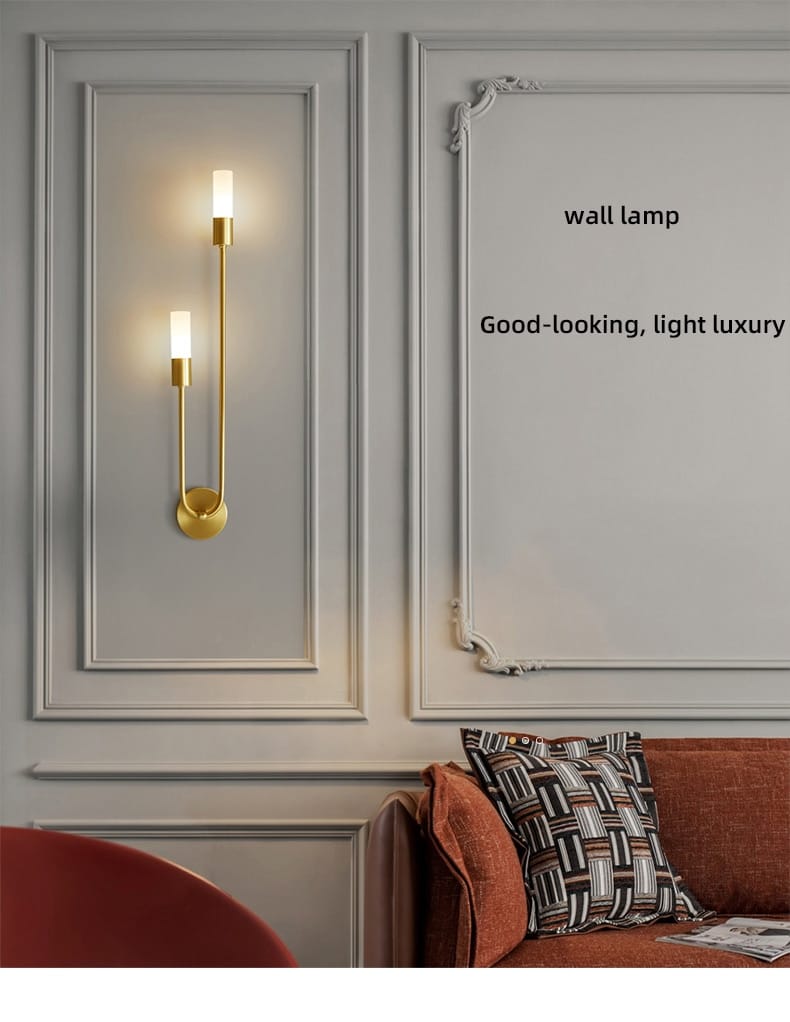 Modern gold minimalist led wall lamp with two vertical candle-style led bulbs and sleek metal design for bedroom use.