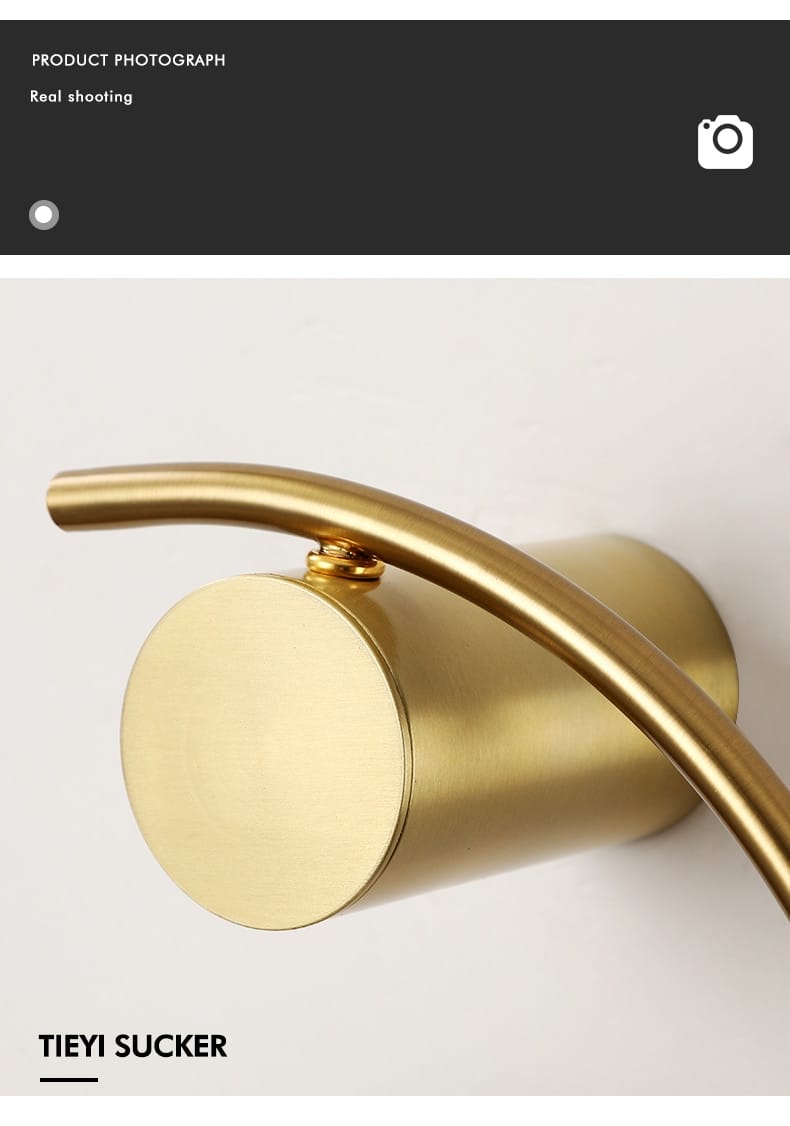 modern gold luxury creative led bedside wall lamp features a gold-toned cylindrical wall-mounted faucet with a sleek curved spout and polished metallic finish designed as a led bedside wall sconce for bedroom use.