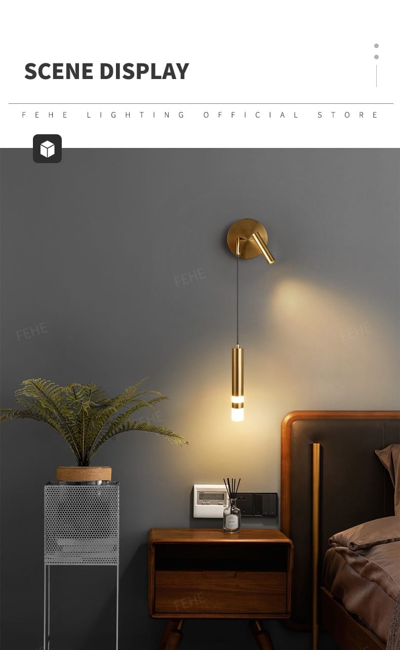 Gold-finished wall-mounted pendant light with a sleek cylindrical design providing warm focused illumination for a minimalist creative luxury bedroom bedside.