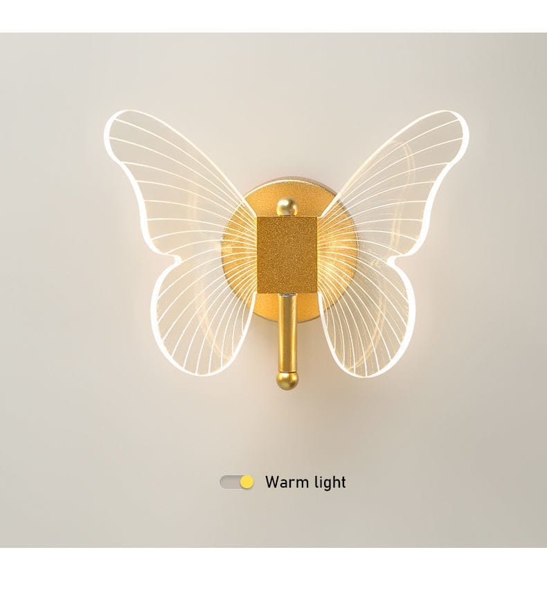 Modern nordic gold led butterfly wall lamp features a gold-toned copper led butterfly design with translucent wings and a glowing warm light ideal for bedroom use.