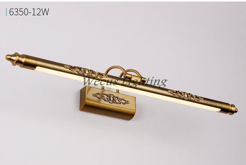 Antique bronze led mirror lamp with brass finish and ornate scrollwork designed for bathroom wall decor.
