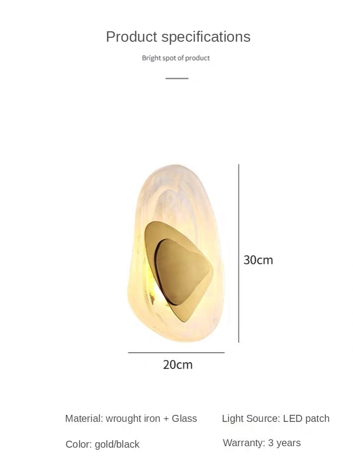 a sleek modern creative minimalist glass wall lamp with a smooth gold and black finish made of wrought iron and glass designed for bedroom bedside lighting