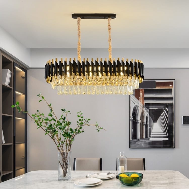 A modern luxury k9 crystal tiered chandelier with black and gold metallic rods hanging from a braided rope suspension designed for dining room lighting.