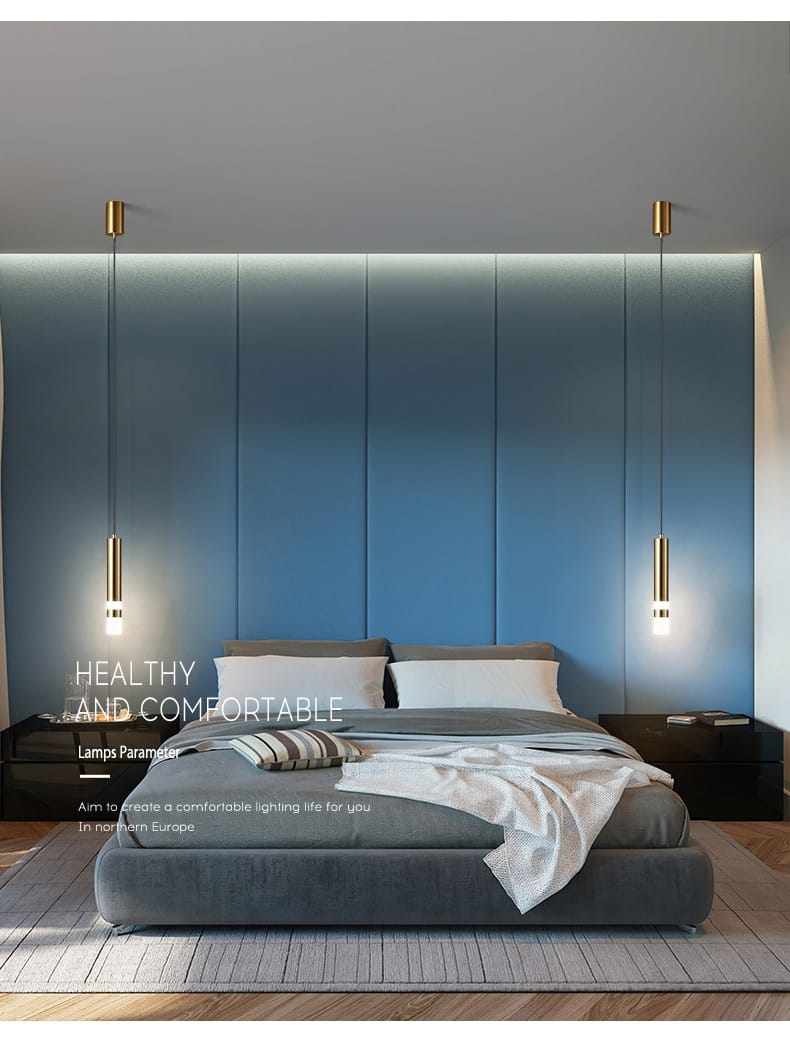 modern gold-toned cylindrical pendant lamps with sleek minimalist design hang symmetrically above the bed in a creative luxury bedroom setting.