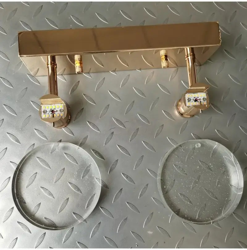 gold-colored metal led wall lamp with two adjustable heads featuring a simple crystal led design for modern bathroom lighting