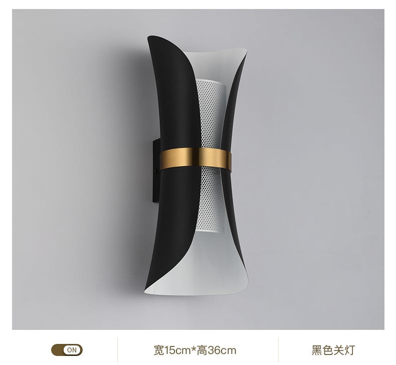 Modern black and white wall lamp with a gold accent band featuring a curved design ideal for bedroom lighting.