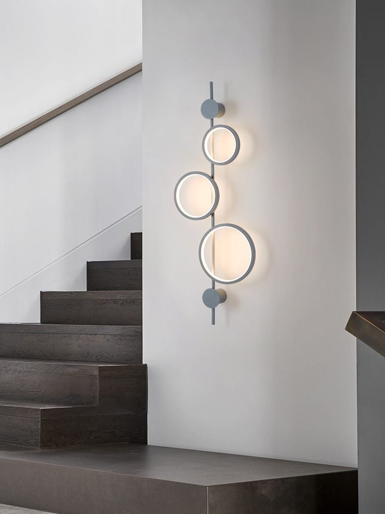 Modern black linear long led wall light featuring a minimalist matte gray metal frame with four circular frosted glass shades suitable for living room use.