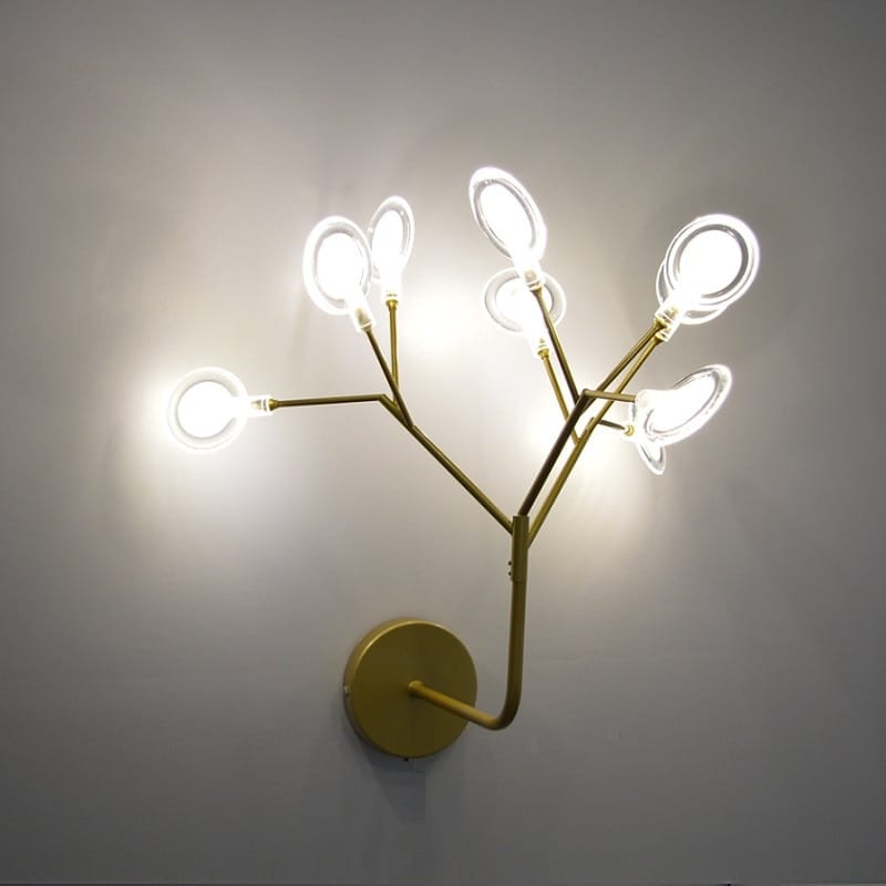 Modern gold firefly tree branch led wall light featuring a gold-toned branching design with multiple illuminated oval-shaped light fixtures, ideal as a decorative led wall light for the bedroom.