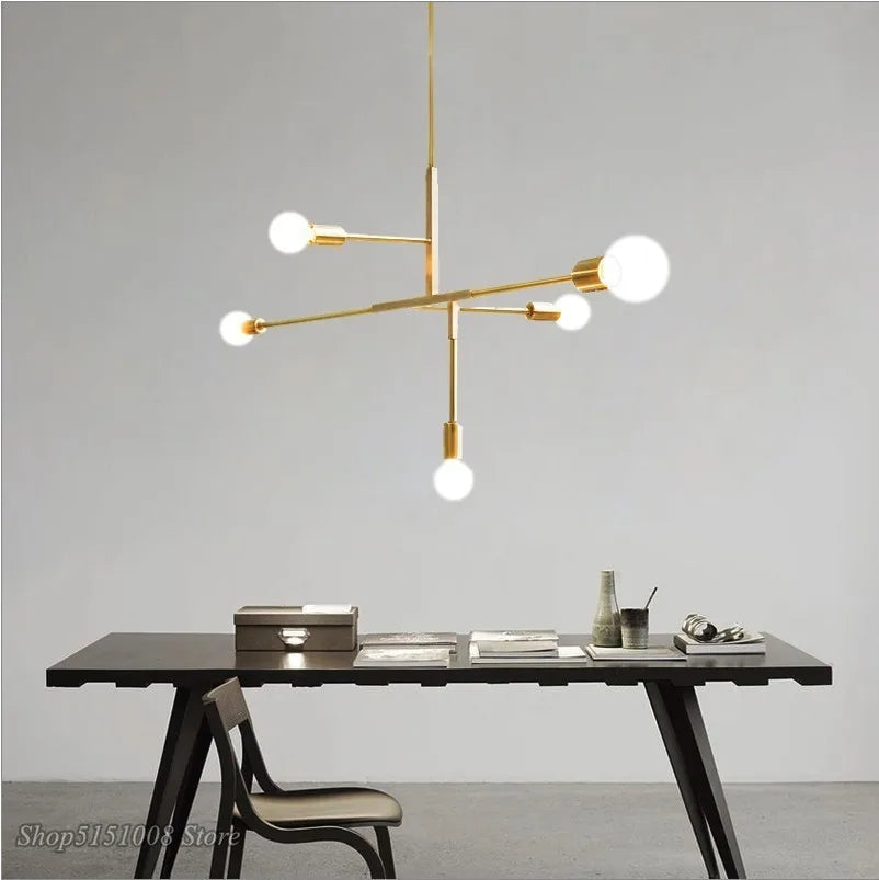 Lámpara colgante DecorBites™ estilo cruz de 5 luces en acabado dorado y negro para decoración moderna del hogar.