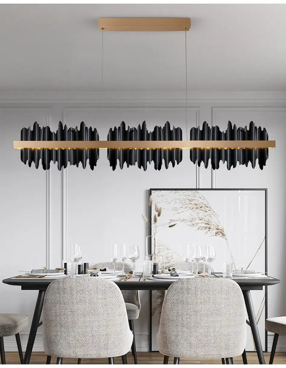 Modern black and gold linear led chandelier lighting with a textured wave-like design perfect for dining room illumination.