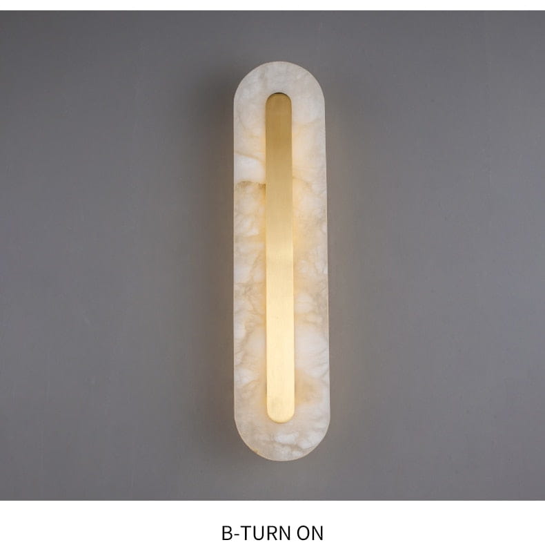 A sleek postmodern copper marble wall lamp with a warm glowing central light set in an off-white marbled stone frame designed for living room use.