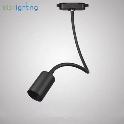 Iluminación industrial con riel de cuello de cisne DecorBites™ para tiendas de ropa