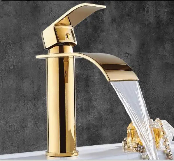 Grifo monomando para lavabo DecorBites™ Gold Waterfall, con cabezal de latón y sistema de sujeción.